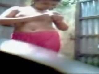 Bengali young lady taking bath